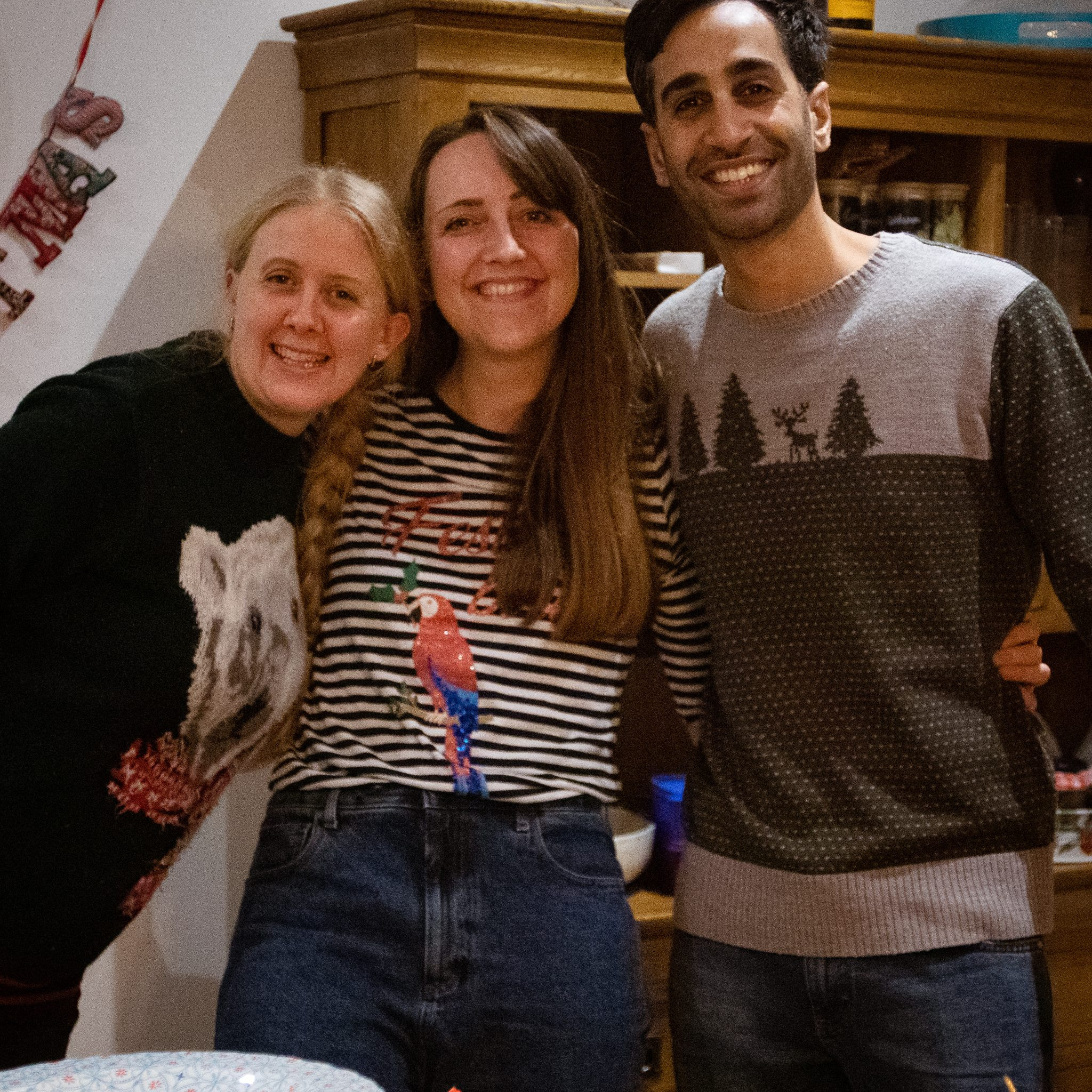 Group of friends smiling in front of food